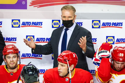Jan 26, 2021; Calgary, Alberta, CAN; Calgary Flames head coach Geoff Ward reacts on his bench during the first period against the Toronto Maple Leafs at Scotiabank Saddledome. Mandatory Credit: Sergei Belski-USA TODAY Sports