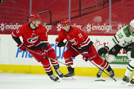 Jan 31, 2021; Raleigh, North Carolina, USA;  Carolina Hurricanes right wing Sebastian Aho (20) and right wing Andrei Svechnikov (37) skate with the puck against the Dallas Stars at PNC Arena. Mandatory Credit: James Guillory-USA TODAY Sports