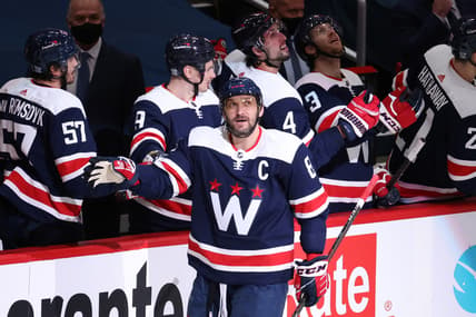 Feb 7, 2021; Washington, District of Columbia, USA; Washington Capitals left wing Alex Ovechkin (8) celebrates with teammates after scoring a goal against the Philadelphia Flyers in the second period at Capital One Arena. Mandatory Credit: Geoff Burke-USA TODAY Sports