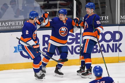 Feb 11, 2021; Uniondale, New York, USA; New York Islanders center Jean-Gabriel Pageau (44) celebrates his powerplay goal with New York Islanders defenseman Nick Leddy (2) and New York Islanders right wing Oliver Wahlstrom (26)  during the first period between the New York Islanders and the Pittsburgh Penguins at Nassau Veterans Memorial Coliseum. Mandatory Credit: Dennis Schneidler-USA TODAY Sports