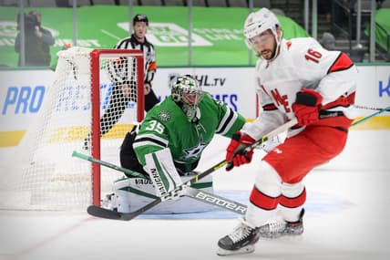 Feb 11, 2021; Dallas, Texas, USA; Dallas Stars goaltender Anton Khudobin (35) defends the goal against Carolina Hurricanes center Vincent Trocheck (16) during the first period at the American Airlines Center. Mandatory Credit: Jerome Miron-USA TODAY Sports