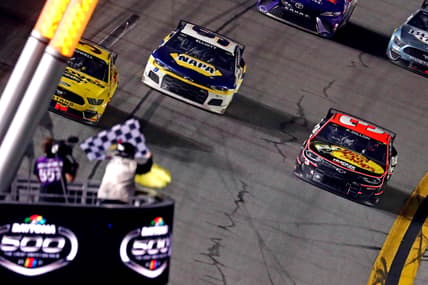 Feb 14, 2021; Daytona Beach, Florida, USA; NASCAR Cup Series driver Michael McDowell (34) leads NASCAR Cup Series driver Chase Elliot (9) to win the during the Daytona 500 at Daytona International Speedway. Mandatory Credit: Mark J. Rebilas-USA TODAY Sports