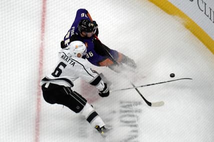 Feb 20, 2021; Glendale, Arizona, USA; Los Angeles Kings defenseman Olli Maatta (6) and Arizona Coyotes right wing Christian Fischer (36) battle for the puck during the first period at Gila River Arena. Mandatory Credit: Joe Camporeale-USA TODAY Sports