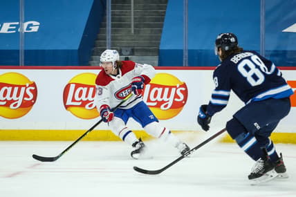 Feb 27, 2021; Winnipeg, Manitoba, CAN;   Montreal Canadiens forward Tyler Toffoli (73) turns away from Winnipeg Jets defenseman Nathan Beaulieu (88) during the first period at Bell MTS Place. Mandatory Credit: Terrence Lee-USA TODAY Sports