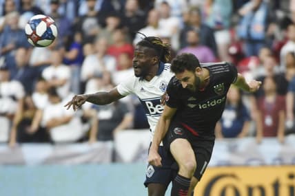 Aug 17, 2019; Vancouver, British Columbia, CAN; DC United defender Steven Birnbaum (15) battles for a header against Vancouver Whitecaps forward Tosaint Ricketts (87) during the second half at BC Place. Mandatory Credit: Anne-Marie Sorvin-USA TODAY Sports