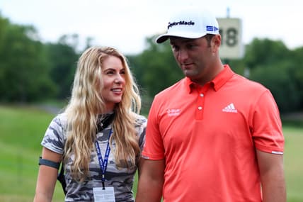 Jul 19, 2020; Dublin, Ohio, USA; Kelley Cahill (left) talks with husband Jon Rahm (right) after he wins The Memorial Tournament at Muirfield Village Golf Club. Mandatory Credit: Aaron Doster-USA TODAY Sports