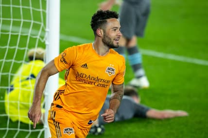 Oct 18, 2020; Saint Paul, MN, Saint Paul, MN, USA; Houston Dynamo midfielder Niko Hansen (12) celebrates after scoring a goal against Minnesota United in the second half at Allianz Field. Mandatory Credit: David Berding-USA TODAY Sports