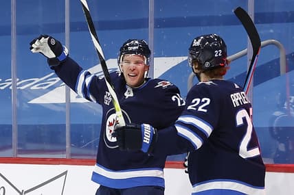Feb 11, 2021; Winnipeg, Manitoba, CAN; Winnipeg Jets center Paul Stastny (25) celebrates his second period goal with center Mason Appleton (22) against the Ottawa Senators at Bell MTS Place. Mandatory Credit: James Carey Lauder-USA TODAY Sports