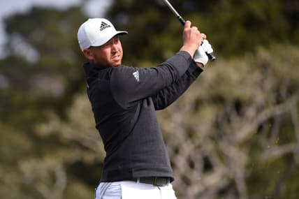 Feb 14, 2021; Pebble Beach, California, USA; Daniel Berger plays his shot from the 16th tee during the final round of the AT&T Pebble Beach Pro-Am golf tournament at Pebble Beach Golf Links. Mandatory Credit: Orlando Ramirez-USA TODAY Sports