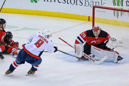 Feb 28, 2021; Newark, New Jersey, USA; New Jersey Devils goaltender Mackenzie Blackwood (29) blocks a shot by Washington Capitals left wing Alex Ovechkin (8) during the first period at Prudential Center. Mandatory Credit: Vincent Carchietta-USA TODAY Sports