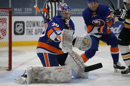 Feb 28, 2021; Uniondale, New York, USA; New York Islanders goalie Ilya Sorokin (30) makes a save against the Pittsburgh Penguins during the third period at Nassau Veterans Memorial Coliseum. Mandatory Credit: Brad Penner-USA TODAY Sports