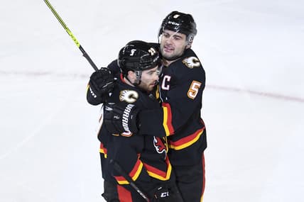 Mar 4, 2021; Calgary, Alberta, CAN; Calgary Flames forward Dillon Dube (29) celebrates his second period goal with defenseman Mark Giordano (5) against the Ottawa Senators at Scotiabank Saddledome. Mandatory Credit: Candice Ward-USA TODAY Sports