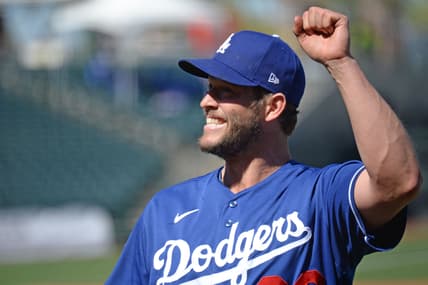 Mar 5, 2021; Surprise, Arizona, USA; Los Angeles Dodgers starting pitcher Clayton Kershaw (22) waves to fans during the second inning of a spring training game against the Kansas City Royals at Surprise Stadium. Mandatory Credit: Joe Camporeale-USA TODAY Sports