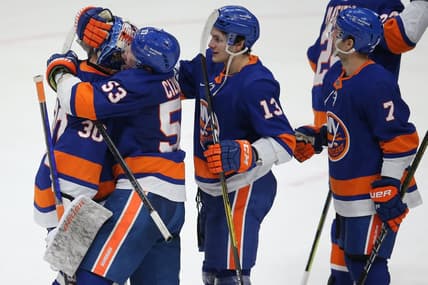 Mar 7, 2021; Uniondale, New York, USA; New York Islanders center Casey Cizikas (53) hugs goalie Ilya Sorokin (30) after defeating the Buffalo Sabres 5-2 at Nassau Veterans Memorial Coliseum. Mandatory Credit: Brad Penner-USA TODAY Sports