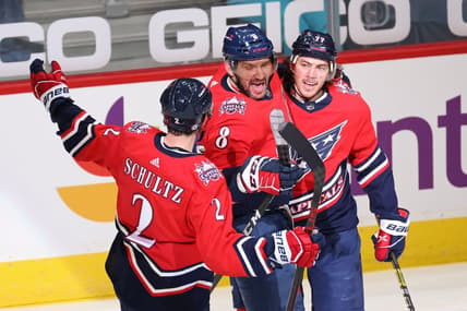 Mar 16, 2021; Washington, District of Columbia, USA; Washington Capitals left wing Alex Ovechkin (8) celebrates with teammates after scoring a goal against the New York Islanders in the second period at Capital One Arena. Ovechkin passed Phil Esposito for sixth all time on the NHL goal scoring list with the goal. Mandatory Credit: Geoff Burke-USA TODAY Sports