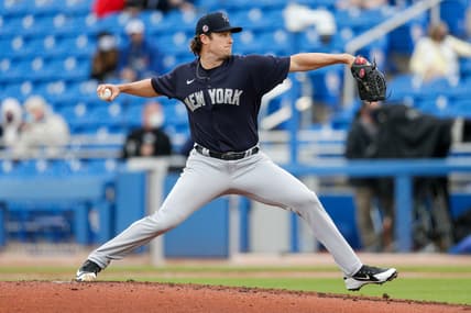 Mar 21, 2021; Dunedin, Florida, USA;  New York Yankees starting pitcher Gerrit Cole (45) pitches in the first inning against the Toronto Blue Jays during spring training at TD Ballpark. Mandatory Credit: Nathan Ray Seebeck-USA TODAY Sports