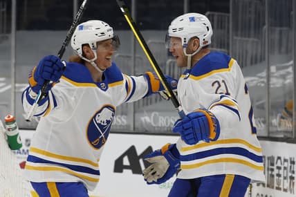 Mar 27, 2021; Boston, Massachusetts, USA; Buffalo Sabres right wing Kyle Okposo (21) celebrates his goal with center Cody Eakin (20) during the second period against the Boston Bruins at TD Garden. Mandatory Credit: Winslow Townson-USA TODAY Sports