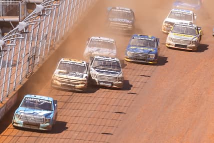 Mar 29, 2021; Bristol, TN, USA; NASCAR Gander RV and Outdoors Truck Series driver Martin Truex Jr. (51) leads a pack of cars at Bristol Motor Speedway. Mandatory Credit: Randy Sartin-USA TODAY Sports