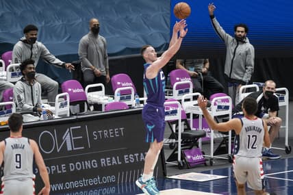 Mar 30, 2021; Washington, District of Columbia, USA;  Charlotte Hornets forward Gordon Hayward (20) takes a three point shot as Washington Wizards guard Jerome Robinson (12) defends during the first half at Capital One Arena. Mandatory Credit: Tommy Gilligan-USA TODAY Sports