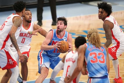 Mar 31, 2021; Brooklyn, New York, USA; Brooklyn Nets small forward Joe Harris (12) controls the ball against Houston Rockets center Christian Wood (35) and power forward D.J. Wilson (0) during the second quarter at Barclays Center. Mandatory Credit: Brad Penner-USA TODAY Sports