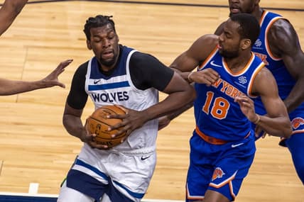 Mar 31, 2021; Minneapolis, Minnesota, USA; Minnesota Timberwolves center Naz Reid (11) drives towards the basket as New York Knicks guard Alec Burks (18) plays defense in the first half at Target Center. Mandatory Credit: Jesse Johnson-USA TODAY Sports