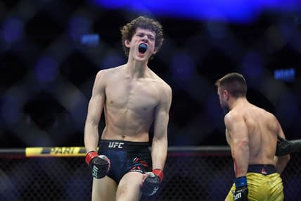 Dec 14, 2019; Las Vegas, NV, USA; Chase Hooper (red gloves) reacts during his bout against Daniel Teymur (blue gloves) during UFC 245 at T-Mobile Arena. Mandatory Credit: Stephen R. Sylvanie-USA TODAY Sports