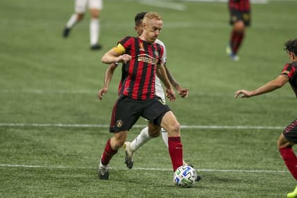 Sep 23, 2020; Atlanta, Georgia, USA; Atlanta United defender Jeff Larentowicz (18) dribbles the ball against FC Dallas in the first half at Mercedes-Benz Stadium. Mandatory Credit: Brett Davis-USA TODAY Sports