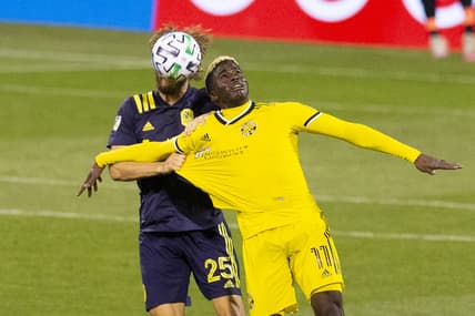Nov 29, 2020; Columbus, Ohio, USA; Columbus Crew SC forward Gyasi Zardes (11) has his jersey pulled by Nashville SC defender Walker Zimmerman (25) in the first half at MAPFRE Stadium. Mandatory Credit: Greg Bartram-USA TODAY Sports