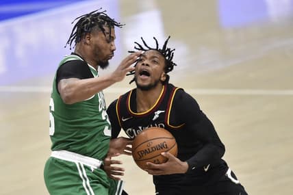 Mar 17, 2021; Cleveland, Ohio, USA; Boston Celtics guard Marcus Smart (36) defends Cleveland Cavaliers guard Darius Garland (10) in the third quarter at Rocket Mortgage FieldHouse. Mandatory Credit: David Richard-USA TODAY Sports