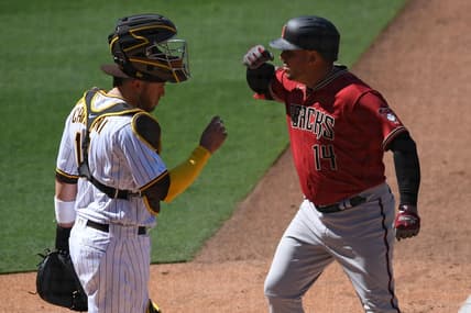 Apr 1, 2021; San Diego, California, USA; Arizona Diamondbacks third baseman Asdrubal Cabrera (14) gestures after hitting a two-run home run as San Diego Padres catcher Victor Caratini (17) looks on during the fifth inning at Petco Park. Mandatory Credit: Orlando Ramirez-USA TODAY Sports