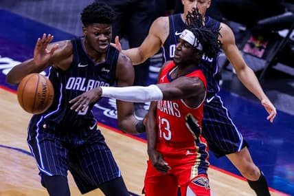 Apr 1, 2021; New Orleans, Louisiana, USA; New Orleans Pelicans guard Kira Lewis Jr. (13) passes the ball against Orlando Magic forward Chuma Okeke (3) during the first half at the Smoothie King Center. Mandatory Credit: Stephen Lew-USA TODAY Sports
