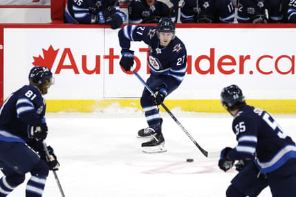 Apr 2, 2021; Winnipeg, Manitoba, CAN;  Winnipeg Jets left wing Nikolaj Ehlers (27) skates up the ice with teammates Winnipeg Jets left wing Kyle Connor (81) and Winnipeg Jets center Mark Scheifele (55) in the first period against the Toronto Maple Leafs at Bell MTS Place. Mandatory Credit: James Carey Lauder-USA TODAY Sports