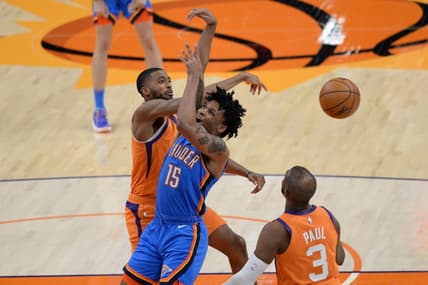 Apr 2, 2021; Phoenix, Arizona, USA; Phoenix Suns forward Mikal Bridges (25) blocks a shot by Oklahoma City Thunder forward Josh Hall (15) during the first half at Phoenix Suns Arena. Mandatory Credit: Joe Camporeale-USA TODAY Sports