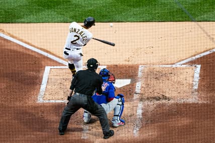 Apr 10, 2021; Pittsburgh, Pennsylvania, USA; Pittsburgh Pirates second baseman Erik Gonzalez (2) hits an RBI double against the Chicago Cubs at PNC Park. Mandatory Credit: Mark Alberti-USA TODAY Sports