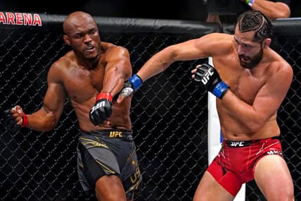 Apr 24, 2021; Jacksonville, Florida, USA; Kamaru Usman (Red Gloves) fights Jorge Masvidal (Blue Gloves) during UFC 261 at VyStar Veterans Memorial Arena. Mandatory Credit: Jasen Vinlove-USA TODAY Sports