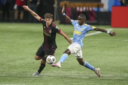 Apr 27, 2021; Atlanta, Georgia, USA; Atlanta United midfielder Emerson Hyndman (20) is defended by Philadelphia Union midfielder Jamiro Monteiro (10) in the first half at Mercedes-Benz Stadium. Mandatory Credit: Brett Davis-USA TODAY Sports