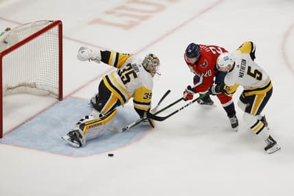 Apr 29, 2021; Washington, District of Columbia, USA; Pittsburgh Penguins goaltender Tristan Jarry (35) makes a save on Washington Capitals center Lars Eller (20) as Penguins defenseman Mike Matheson (5) defends in the first period at Capital One Arena. Mandatory Credit: Geoff Burke-USA TODAY Sports