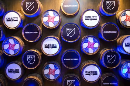 Dec 17, 2019; Charlotte, NC, USA; A general view of the logos hanging on the wall during the fan fest party at held at Brewers at 4001 Yancey. Mandatory Credit: Jeremy Brevard-USA TODAY Sports