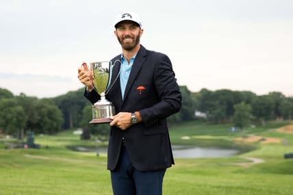 Jun 28, 2020; Cromwell, Connecticut, USA; Dustin Johnson poses with the trophy after winning the Travelers Championship golf tournament at TPC River Highlands. Mandatory Credit: Bill Streicher-USA TODAY Sports