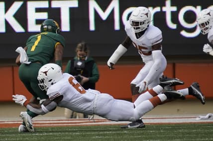 Oct 24, 2020; Austin, Texas, USA; Texas Longhorns linebacker Juwan Mitchell (6) tackles the Baylor Bears running back Trestan Ebner (1) in the fourth quarter at Darrell K Royal-Texas Memorial Stadium. Mandatory Credit: Scott Wachter-USA TODAY Sports