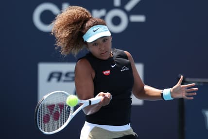 Mar 31, 2021; Miami, Florida, USA; Naomi Osaka of Japan hits a forehand against Maria Sakkari of Greece (not pictured) in a women's singles quarterfinal in the Miami Open at Hard Rock Stadium. Mandatory Credit: Geoff Burke-USA TODAY Sports