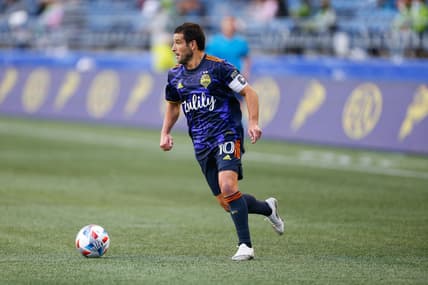 May 2, 2021; Seattle, Washington, USA; Seattle Sounders FC midfielder Nicolas Lodeiro (10) dribbles against the Los Angeles Galaxy during the second half at Lumen Field. Mandatory Credit: Jennifer Buchanan-USA TODAY Sports