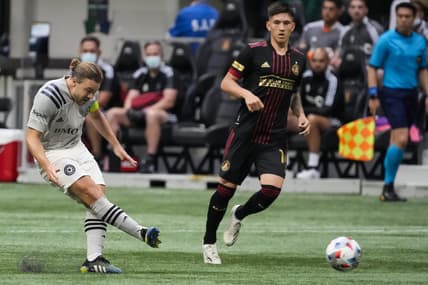May 15, 2021; Atlanta, Georgia, USA; CF Montr al midfielder Samuel Piette (left) takes a free kick against Atlanta United during the first half at Mercedes-Benz Stadium. Mandatory Credit: Dale Zanine-USA TODAY Sports