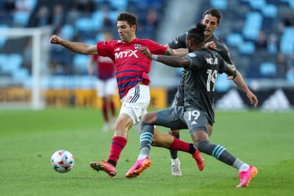 May 15, 2021; Saint Paul, MN, Saint Paul, MN, USA; FC Dallas midfielder Ryan Hollingshead (12) and Minnesota United defender Romain Metanire (19) compete for the ball i the first half at Allianz Field. Mandatory Credit: David Berding-USA TODAY Sports