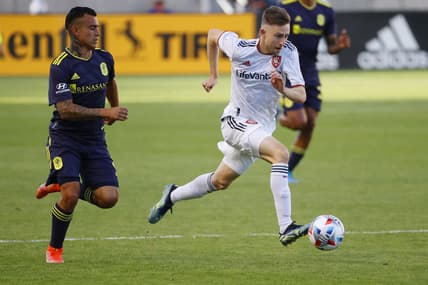 May 15, 2021; Sandy, Utah, USA; Nashville SC midfielder Randall Leal (8) and Real Salt Lake defender Andrew Brody (2) battle in the first half at Rio Tinto Stadium. Mandatory Credit: Jeffrey Swinger-USA TODAY Sports