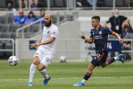 May 16, 2021; Cincinnati, OH, USA; Inter Miami forward Gonzalo Higuain (9) battles for the ball against FC Cincinnati midfielder Alvaro Barreal (31) in the first half at TQL Stadium. Mandatory Credit: Katie Stratman-USA TODAY Sports