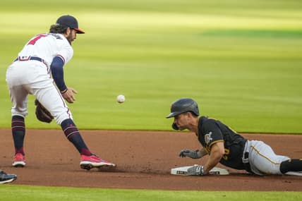May 20, 2021; Cumberland, Georgia, USA; Pittsburgh Pirates second baseman Adam Frazier (26) slides into second base after hitting a double against the Atlanta Braves during the first inning at Truist Park. Mandatory Credit: Dale Zanine-USA TODAY Sports
