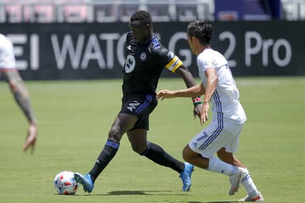 May 22, 2021; Fort Lauderdale, FL, USA; CF Montreal midfielder Victor Wanyama (2) controls the ball around FC Cincinnati forward Yuya Kubo (7) during the first half at DRV PNK Stadium. Mandatory Credit: Sam Navarro-USA TODAY Sports
