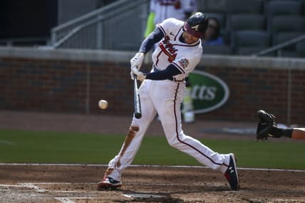 May 22, 2021; Atlanta, Georgia, USA; Atlanta Braves first baseman Freddie Freeman (5) hits a RBI single against the Pittsburgh Pirates in the second inning at Truist Park. Mandatory Credit: Brett Davis-USA TODAY Sports