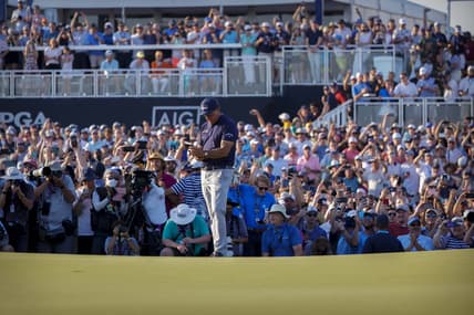 May 23, 2021; Kiawah Island, South Carolina, USA; Phil Mickelson checks his notes before putting on the 18th green during the final round of the PGA Championship golf tournament. Mandatory Credit: Geoff Burke-USA TODAY Sports